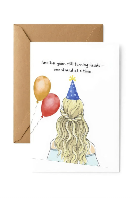 Happy birthday card: 'Another year, still turning heads — one strand at a time.'